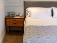 Hotel Boutique Can Sastre - Ciutadella, Menorca - Bedside table with retro radio - SecretPlaces