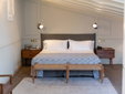 Hotel Boutique Can Sastre - Ciutadella, Menorca - Bedroom with exposed beams - SecretPlaces