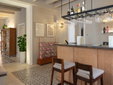 Hotel Boutique Can Sastre - Ciutadella, Menorca - Bar counter with hanging glasses - SecretPlaces