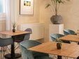 Hotel Boutique Can Sastre - Ciutadella, Menorca - Dining area with wooden tables - SecretPlaces